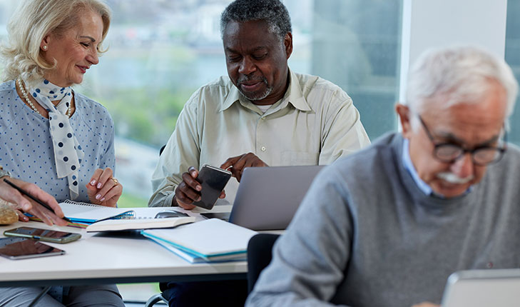 Seniors working together in an office