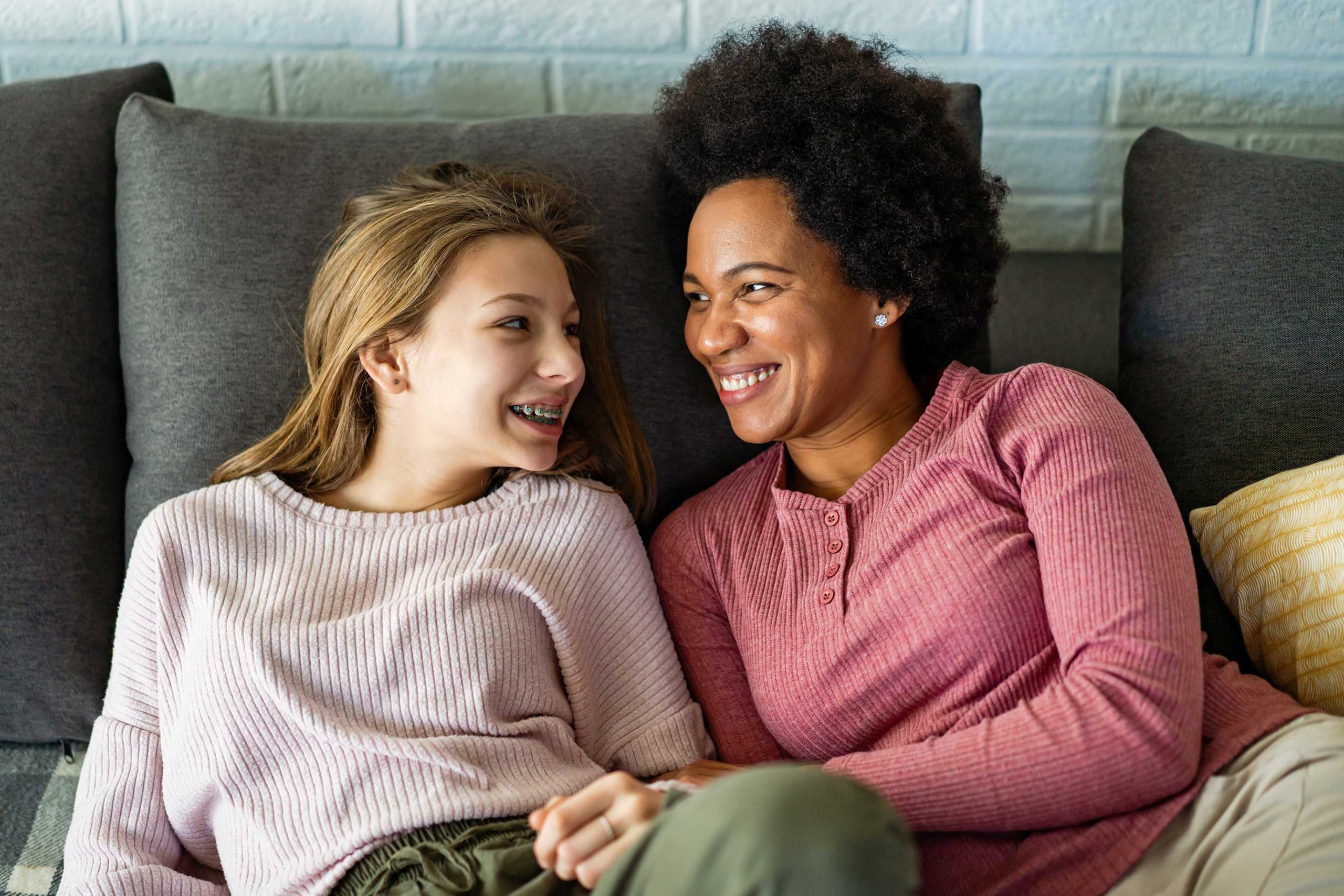 woman looking at teen girl